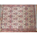 An extremely fine Northwest Persian Afshar rug with all over petal motifs on an ivory field within