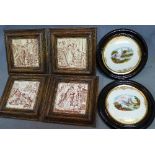 A set of four early 20th century ceramic tiles, in oak frames, together with a pair of porcelain