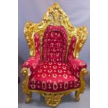 A Rococo style giltwood throne chair, having red button back upholstery with wreath design, raised