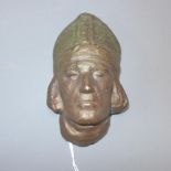 A cast bronze study of a Bishop's head, H.15cm
