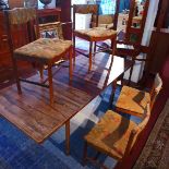 A mid 20th century Archie Shine rosewood dining table, with fold-in leaf, together with four