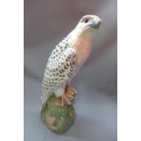 A Royal Copenhagen 1661 perched Icelandic falcon, signed Herald, H.40cm