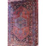 A fine North West Persian Zanjan rug, central diamond medallion with repeating petal motifs on a