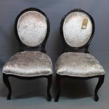 A pair of Contemporary ebonised chairs, with velvet upholstery, raised on cabriole legs