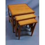 A mid 20th century teak nest of three tables