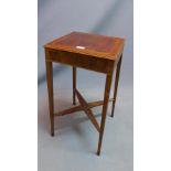 An early 20th century mahogany and walnut samovar table, raised on tapered legs, joined by