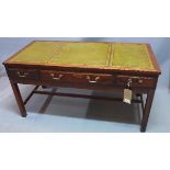 An early 20th century mahogany campaign desk, with green leather skiver, three drawers, raised on