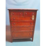 An early 20th century American mahogany chest, of two short over three long graduating drawers,