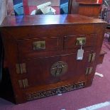 An early 20th century Chinese elm side cabinet, with two drawers over two doors, H.85 W.97 D.60cm