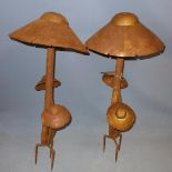 A pair of rusty sheet metal mushrooms, H.88cm