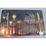 A gold plated set of cutlery