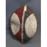 A late 19th / early 20th century Maasai warrior shield of oval form, made from Buffalo hide,