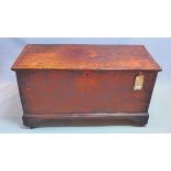 An 18th century oak and elm blanket chest, with hinge lid enclosing candle box, raised on bracket