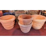Four terracotta planters, comprising two large and two small, H.49 W.65 (large) H.40 W.52cm (small)