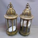 A pair of gilt metal storm lanterns, of octagonal form with pierced dome tops, H.58cm