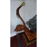 Two rusty sheet metal herons, H.144cm