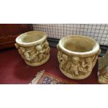 Two reconstituted stone planters, decorated with a procession of cherubs, H.23cm Diameter 42cm