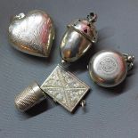 A collection of silver, to include a locket in form of an acorn, Birmingham, a heart shaped