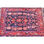 A fine Northwest Persian Hamadan rug, with repeating floral motifs on a sapphire field within