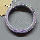 A Chinese lavender jadeite bangle, with carved scrolling foliate decoration, Diameter 6.2cm (inside)