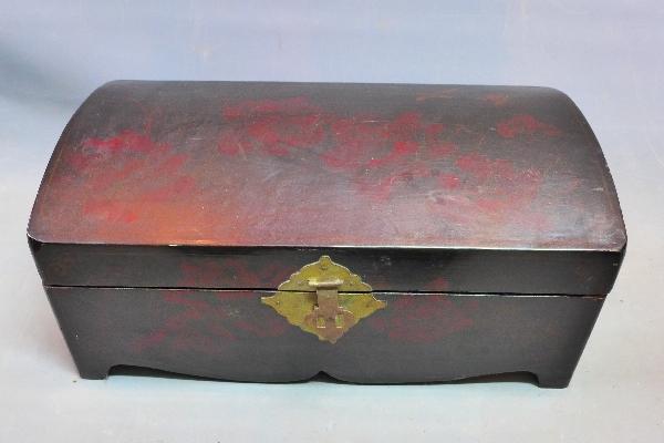 A mid 20th century Japanese lacquered table top casket, with dome top, H.27 W.61 D.34cm