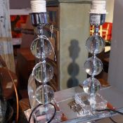 A pair of glass and perspex table lamps