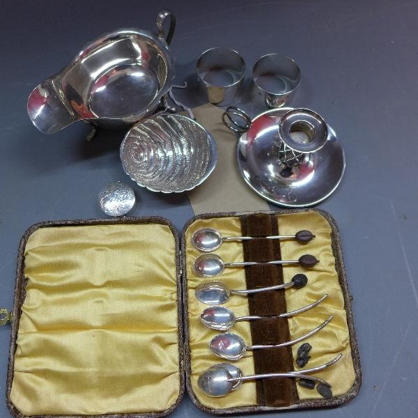 A miscellaneous collection of silver to include, a gravy boat, danish silver chamber stick by