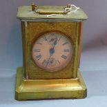 An early 20th century brass musical mantle clock