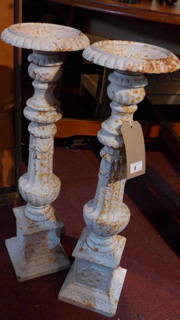 A pair of cast iron pricket sticks