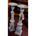 A pair of cast iron pricket sticks