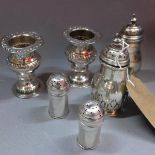 Two pairs of silver pepperettes, together with a pair of miniature white metal urns