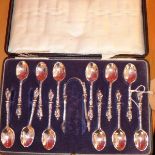 A set of silver apostle spoons and tongs, in original box