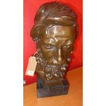 A bronze bust of a bearded man in the Classical style on a marble plinth base, H.55cm