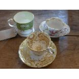 A 19th century porcelain tankard and two 19th century tea cups and saucers