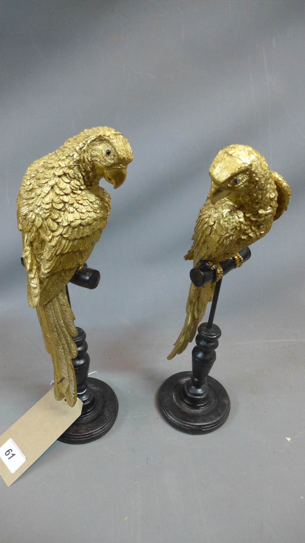 A pair of gilt fibre glass models of parrots, H.37cm