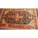 A fine North West Persian Koliahee rug, central diamond medallion on a midnight field guarded by