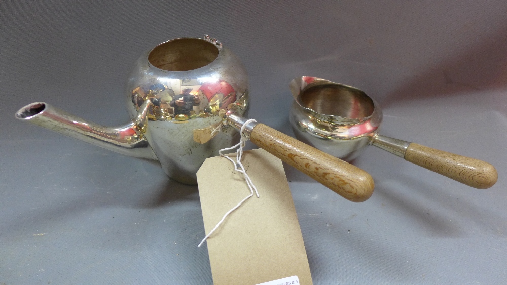 A Mexican silver tea pot and milk jug