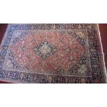 An extremely fine Central Persian Kurk Kashan rug, the central medallion on a light red field with