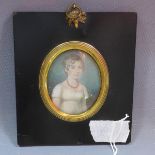 A 19th century miniature painted portrait of Elizabeth Naylor in brass mounted ebonised frame, 7 x