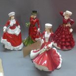 Four Royal Doulton figurines, 'Christmas Day 2009', 'Christmas Day 2007', 'Pretty Ladies,