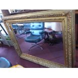 A large ornately decorated wall or pier mirror in rectangular frame with bevelled edge plate h156