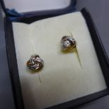 A pair of 9ct gold and diamond inset earrings, of knotted design, stamped 375