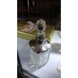 A cut glass scent bottle with hallmarked silver collar and shoulders H.20cm