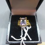A ladies 9ct yellow gold, amethyst and citrine ring, shank stamped 9k
