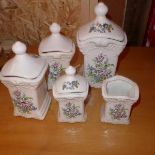 A set of five Delft ceramic caddies