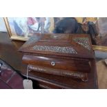 A 19th century rosewood tea caddy having shell fretwork and coromandel wood compartmentalised