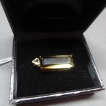A 9ct yellow gold, smokey quartz and diamond inset pendant