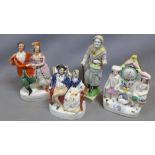 A collection of four Staffordshire figural studies, to include an elderly lady carrying a basket