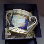 A Royal Worcester porcelain twin handled loving cup to mark the millenium numbered 199/500 in