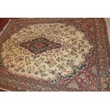 A large Persian carpet, having central floral medallion within floral border on brown ground,